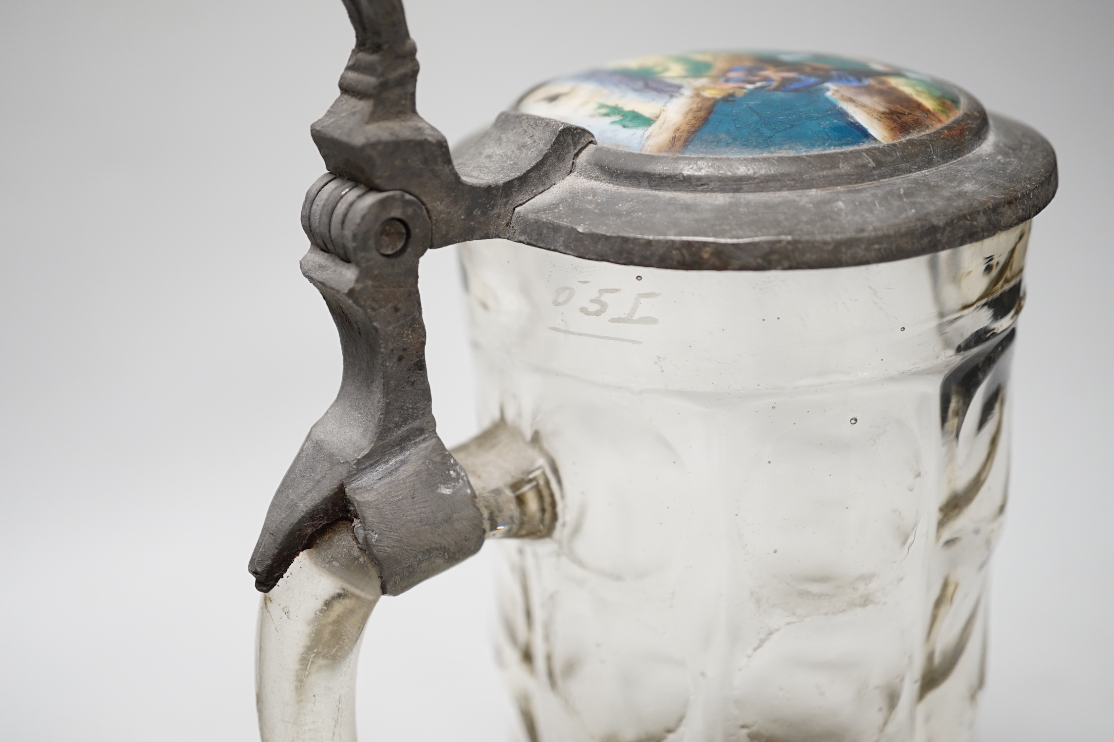 A German faience stein, dated 1819, a glass stein and an inkwell, largest 24cm